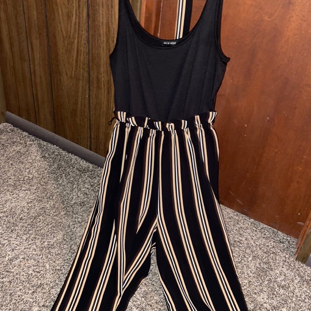 As U Wish, medium black jumpsuit with white and gold stripes.